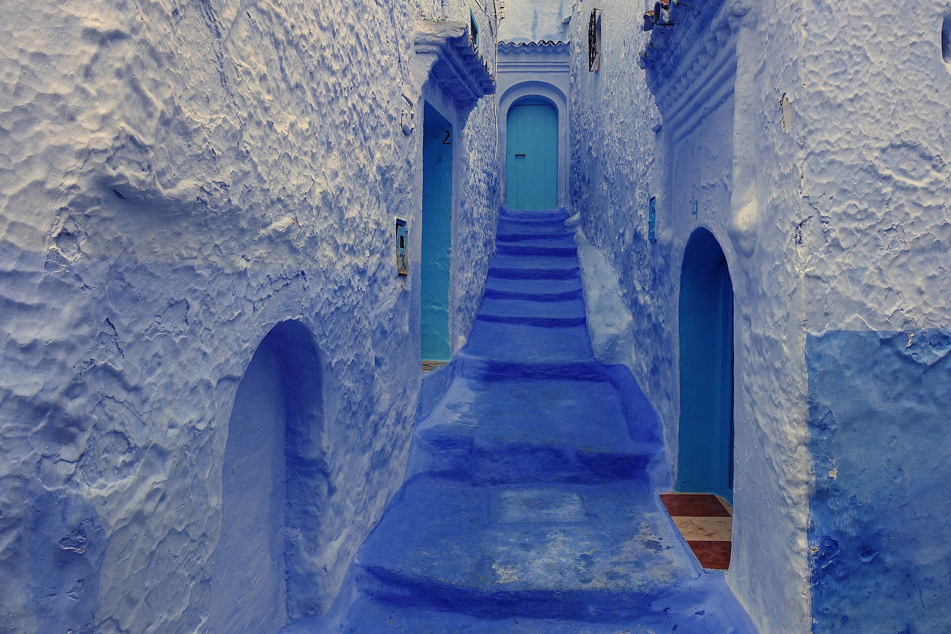 A blue-painted staircase and houses in the medina of Chefchaouen