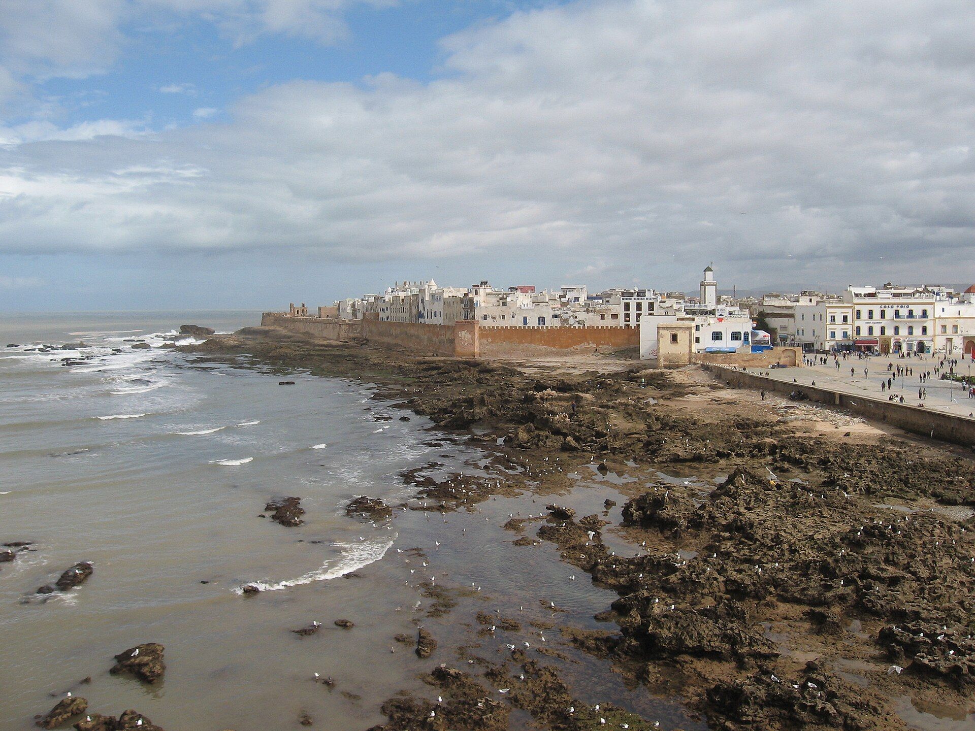 The city walls of Essaouira on the Atlantic Ocean, with waves on the rocks in front